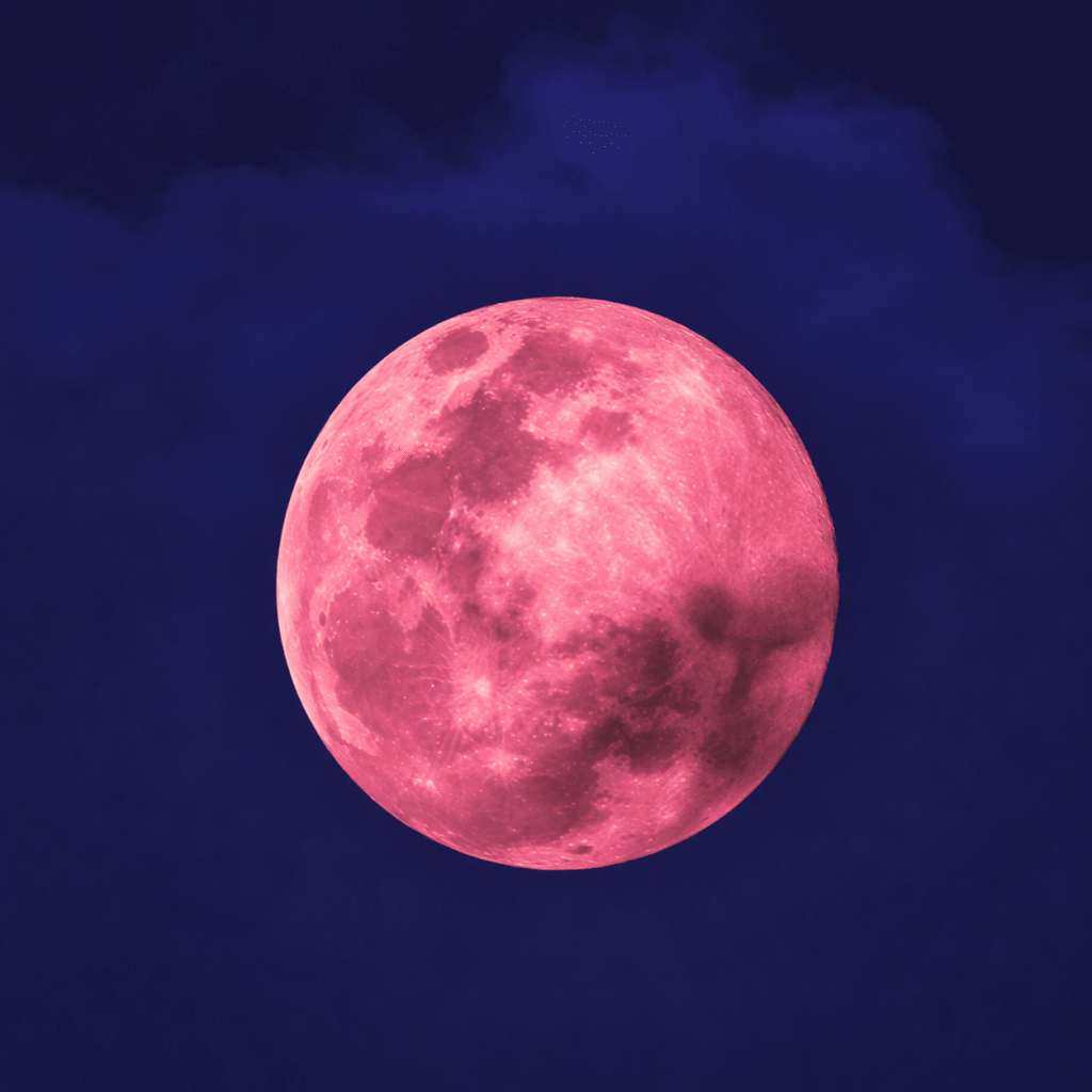 Pink full moon over dark skies