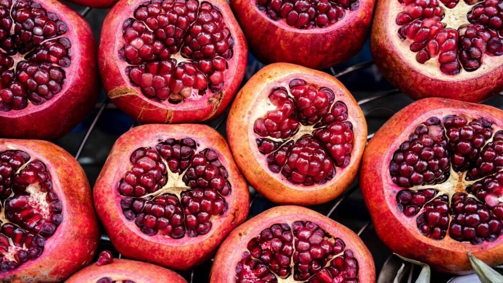 Freshly cut pomegranate fruit wallpaper